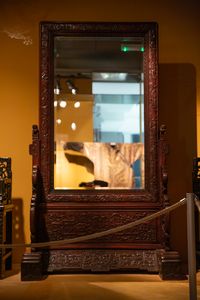 A Chinese wooden mirror in the Skušek Collection, <!--LINK'" 0:232-->.