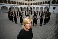 Conductor <!--LINK'" 0:250--> with <!--LINK'" 0:251--> choir in the <!--LINK'" 0:252--> courtyard at Kostanjevica na Krki