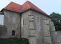 The south-east view of the synagogue after its restoration in 2001. The building forms a part of the Maribor medieval town walls above the Drava River; <!--LINK'" 0:521-->.