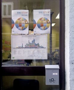 <!--LINK'" 0:35--> infographic calendar next to the <!--LINK'" 0:36--> posters on the festival's office window, 2012