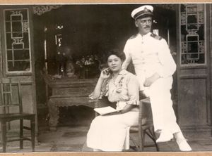 Ivan Skušek and his wife to be Tsuneko Kondō Kawase in Beijing, between 1918–1920. (The photo is kept in the library of the <!--LINK'" 0:250-->, the original is kept by Skušek's great-nephew Janez Lombergar.)