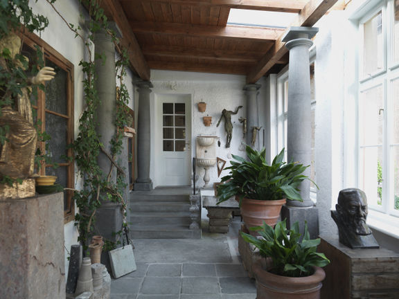 The entry porch in Plečnik House, with the master's collection of sculptures and spolia, 2015. Photo by Matevž Paternoster/Museum and Galleries of Ljubljana.