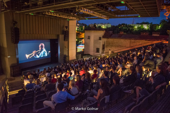 Screening of the film Miles Ahead, an American biographical drama that interprets the life and compositions of jazz musician Miles Davis, at the Minoriti Open Air Cinema, 2017.