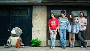 <!--LINK'" 0:32--> posing together with their mascot at <!--LINK'" 0:33--> in 2015