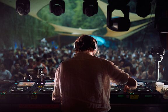 Butik Festival: German DJ Gerd Janson performing on the main stage on the beach near the Soča River