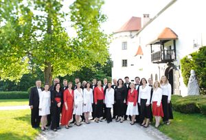 Group portrait of the <!--LINK'" 0:185-->'s members. The award winning choir has toured widely worldwide with a broad and diverse programme that includes work of Slovenian composers  <!--LINK'" 0:186-->, <!--LINK'" 0:187-->, and <!--LINK'" 0:188-->. 2011
