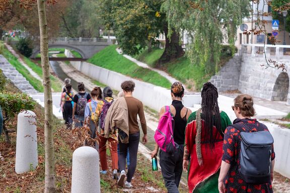 A soundwalk at TOpot festival taking place on the bank of Gradaščica river in Ljubljana, september 2025. Photo: Matej Tomažin
