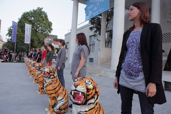 Marcello Maloberti's Die Schmetterlinge essen die Bananen, a performance in front of Moderna galerija (MG) at the 29th Biennial of Graphic Arts curated by Beti Žerovc under the title The Event, 2011.