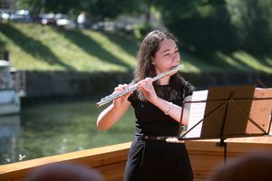 Ana Votupal partaking in a series of classical music concerts held at the Ljubljanica river, <!--LINK'" 0:168-->, 2016