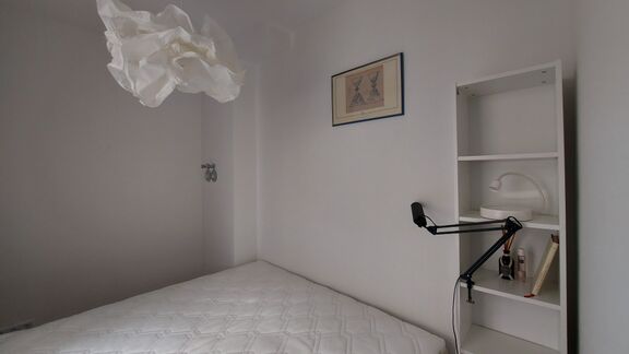 The bedroom of the Slovene Arts & Culture Residency, Berlin, 2022