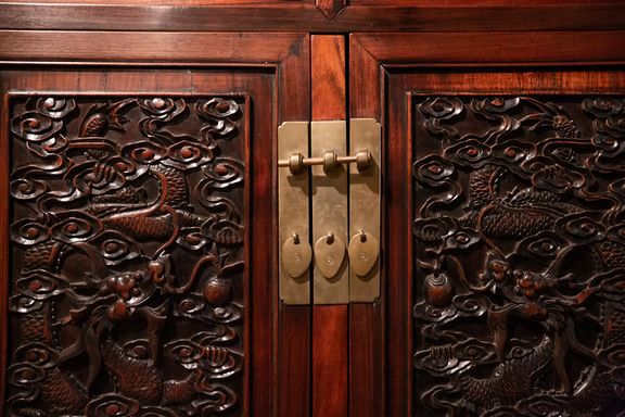 Exquisite wooden carving detail on a piece of 19th-century Chinese furniture in the Skušek Collection, Slovene Ethnographic Museum.