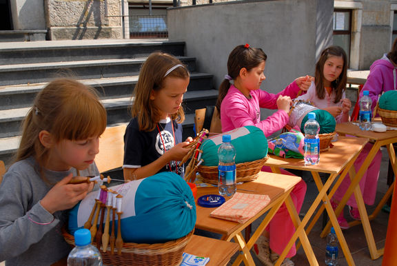 Students of the Idrija Lace School giving a demonstration at the Idrija Lace Festival