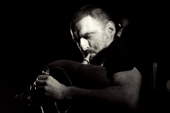 Dario Cortese, playing on Scottish bagpipes during the Crazed Farmers performance at Klub Gromka, 2009