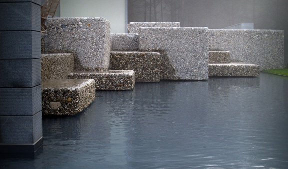 Floating rocks and water bubbles in the terraced garden located at the end of a small town set within the old pine forest. Designed by Landscape studio, Domžale next to Ljubljana, 2007