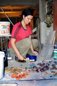 Making a mosaic, during working to refurbish new premises, photograph exhibited in the exhibition <i>Tinčkaua bytes and CMAK</i>, <!--LINK'" 0:738-->