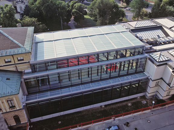 National Gallery of Slovenia south view with the Ravnikar's northern wing (on the right) and the glass entrance hall by SADAR + VUGA Architects