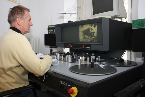 Work behind the assembly table at the Archives of the Republic of Slovenia