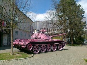 The tank from the Ten-Day War in Slovenia (1991) in front of the <!--LINK'" 0:1-->. On the eve of the International Women's Day in 2012 it was sprayed pink by the unknown activists and became a new popular landmark in Ljubljana. It is owned by the <!--LINK'" 0:2--> and was transferred to the <!--LINK'" 0:3--> only a few months after the action. The pink paint was removed.