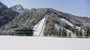 A newly-constructed pavilion opened in 2016 houses also a <!--LINK'" 0:178-->. In the background, on the left side the 'Gorišek Brothers Ski Flying Hill' built in 1969, while the 'Bloudek Giant' is seen on the right-hand side. The latter was finished in 1934, when it also claimed its first world record.