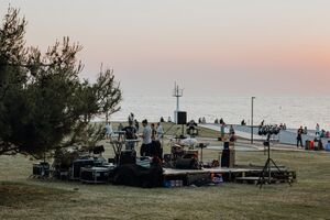 Musicians preparing for an evening performance at the Lighthouse, <!--LINK'" 0:282--> 2022. Author: Amadeja Smrekar