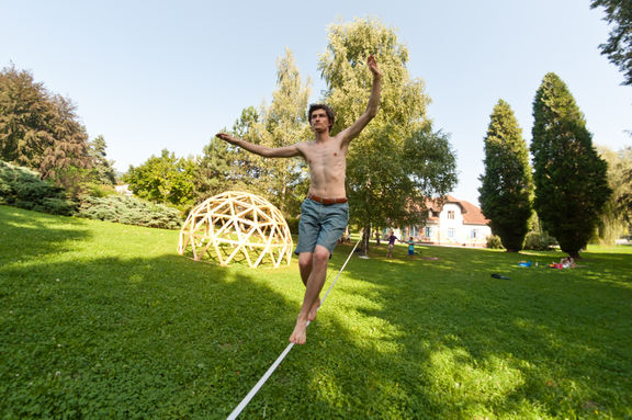 A slack-lining workshop taking place during the Kunigunda Festival of Young Cultures, 2011