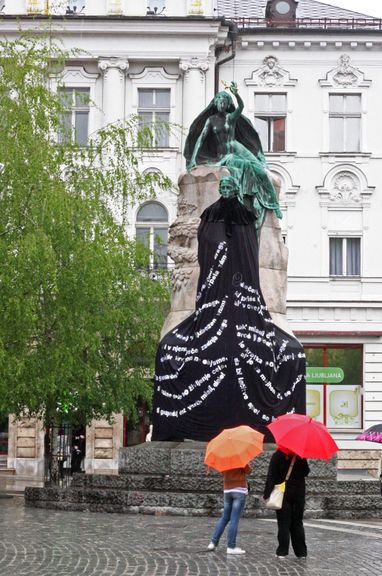 Prešeren's Coat, by Andreja Brulc, art installation using passages from the poet's longest poem Krst pri Savici[Baptism at Savica] on a new robe dressing Prešeren's monument, World Literatures - Fabula Festival, 2010