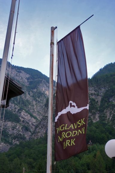 Triglav National Park flag in front of Trenta Lodge TNP Information Centre and Museum , 2014