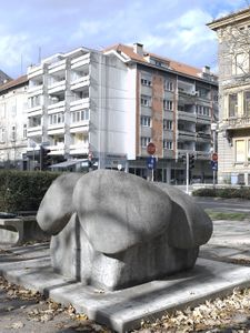 <i>Flower</i> (125 x 175 x 175 cm), reinforced concrete by <!--LINK'" 0:157--> from 1983, located in front of the Faculty of Economics and Business, part of the <!--LINK'" 0:158-->