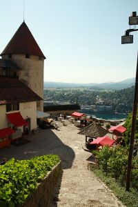 View looking down into the lower courtyard, showing castle outbuildings at <!--LINK'" 0:19-->, the tower now holds the Castle printing works 2010