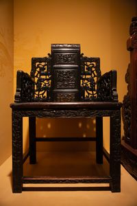 An exquisitely-carved Chinese wooden chair in the Skušek Collection, <!--LINK'" 0:78-->.