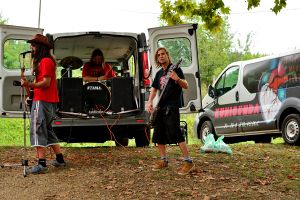 A band performing out of a van at <!--LINK'" 0:82-->, 2015