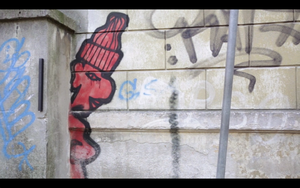 A still frame from the <!--LINK'" 0:307--> promo video featuring grafitti in Ljubljana, 2013