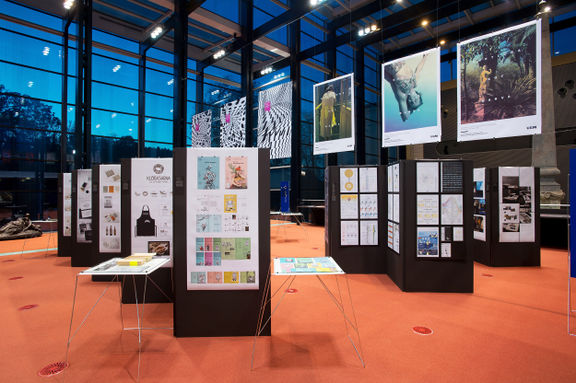 The glass entrance hall of the National Gallery of Slovenia hosting the Biennial of Slovene Visual Communications, 2015