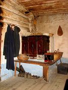 Typical Slovenian tiled stove for heating in Kavčnik Homestead with benches around it for sitting on colder evenings