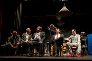 Actors Tomaž Urgl (in the back), Bojan Vister, Marko Skok, Srečko Kermavner, Tone Bertoncelj, Elias Rudolf, Jaša Levstik, and Janez Vlaj star in Reginald Rose's play <i>12 Angry Men</i>. Directed by Ira Ratej and produced by <!--LINK'" 0:908-->, the play won the Matiček award for best overall performance at the <!--LINK'" 0:909--> in 2019. Author: Matej Maček