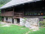 The entrance of Kavčnik Homestead, a museum of folk architecture with the core of the building -the smoke house - dating from circa 17th century. Established as a museum in 1992 and administered by Velenje Museum.