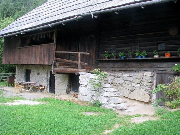 The entrance of Kavčnik Homestead, a museum of folk architecture with the core of the building -the smoke house - dating from circa 17th century. Established as a museum in 1992 and administered by Velenje Museum.