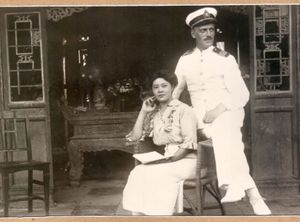 Ivan Skušek and his wife to be Tsuneko Kondō Kawase in Beijing, between 1918–1920. (The photo is kept in the library of the <!--LINK'" 0:90-->, the original is kept by Skušek's great-nephew Janez Lombergar.)