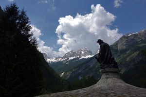 A statue of Julius Kugy with the orientation toward Jalovec Mountain. Julius Kugy (1858-1944) was a mountaineer and researcher of Julian Alps, <!--LINK'" 0:544-->, 2014