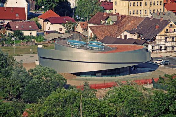 The Cultural Centre of European Space Technologies (KSEVT) building design is the work of four architectural bureaus which established the Architectural Union for Vitanje (AZZV): Bevk Perović Arhitekti, Dekleva Gregorič Arhitekti, Ofis Arhitekti, and SADAR + VUGA Architects.