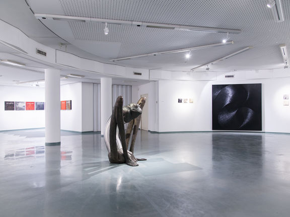 A sculpture by Mirko Bratuša and a painting by Sandi Červek, exhibited at the Nova Gorica City Gallery, 2014