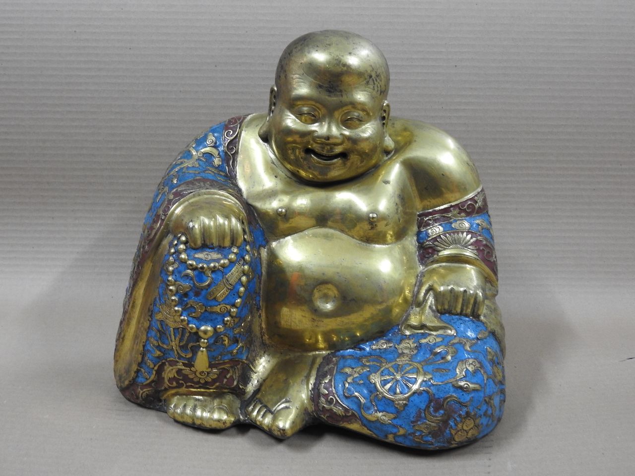 The Hidden Gems of Slovenian Museums Smiling Buddha artefact Slovene Ethnographic Museum.jpg